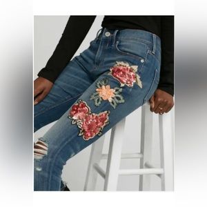 Express mid rise jeans with flower embellishments
